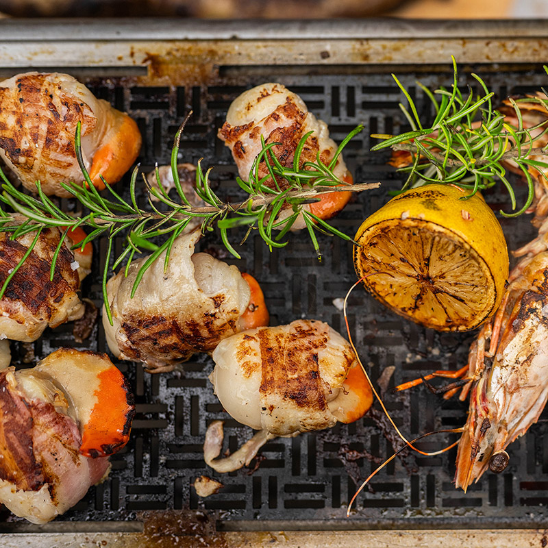 King Prawns, Scallops & Charred Lemon Cooked Over Embers