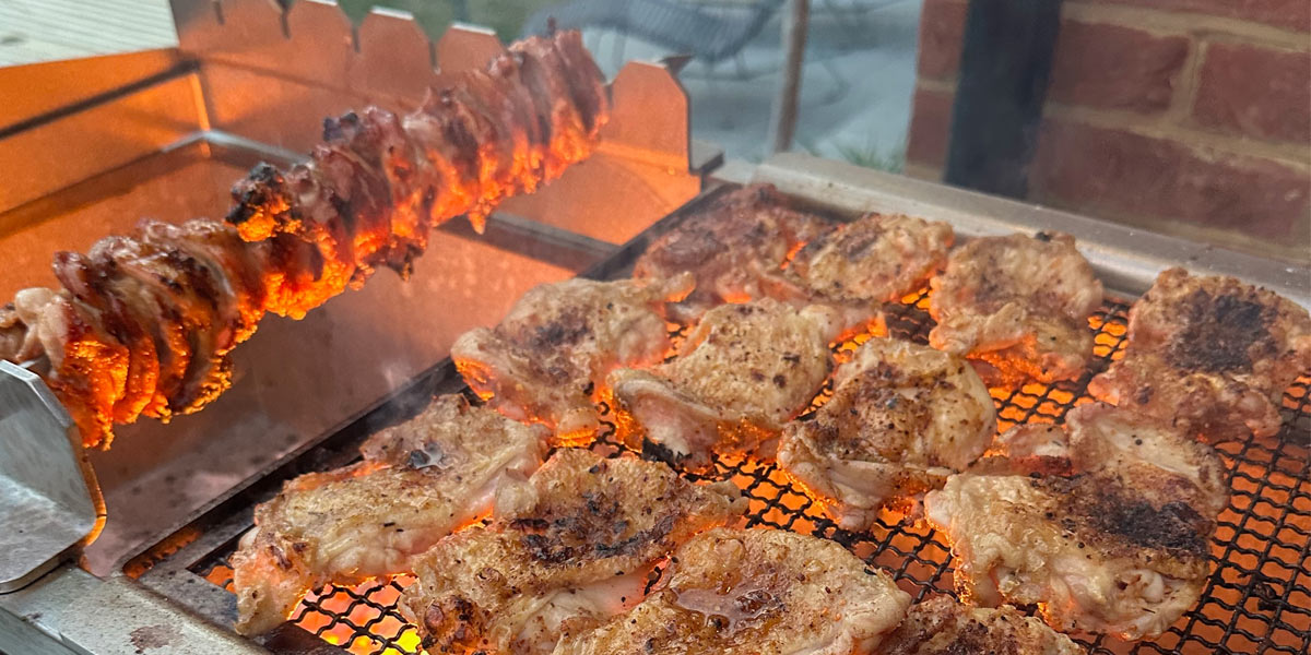 GrillBox modular charcoal cooking system with chicken and yakitori skewers